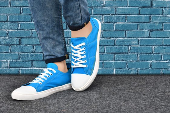 A fashionable blue canvas sneaker with white laces and a white rubber sole, featuring a clean toe design, perfect for street-style fashion and casual wear